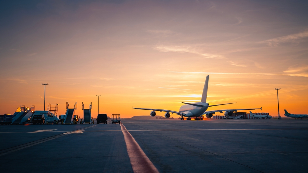 traffic,at,airport,at,golden,sunset.,wide,shot,of,passenger